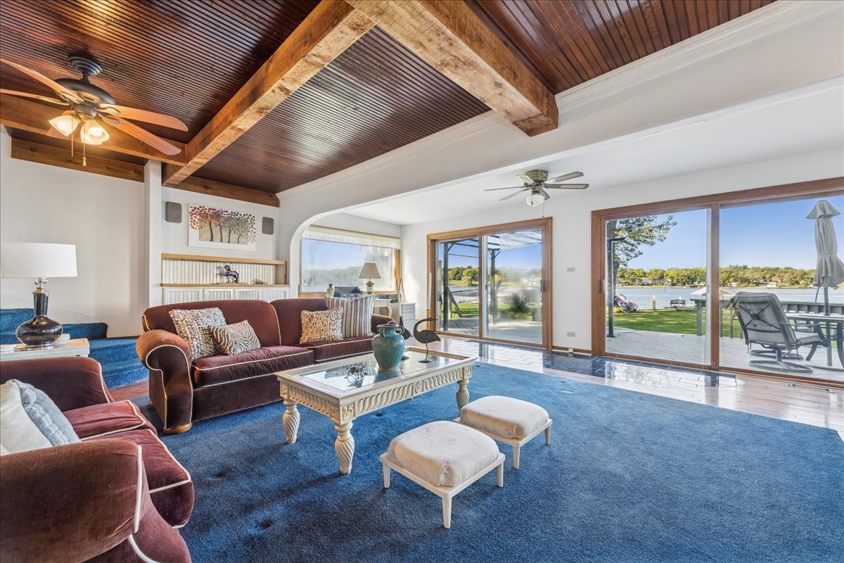 712 Regner Road McHenry, IL 60051 - Photo 11 of 25 a living room with furniture and a floor to ceiling window
