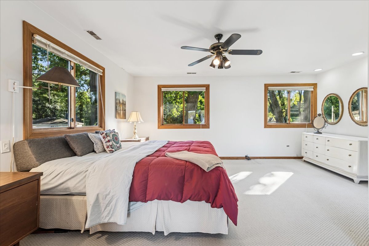 712 Regner Road McHenry, IL 60051 - Photo 17 of 25 a bedroom with a bed and window