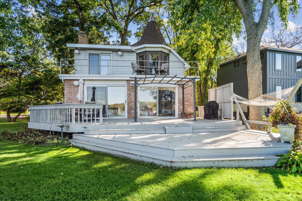 712 Regner Road McHenry, IL 60051 - Photo 5 of 25 a view of a house with a yard and large tree
