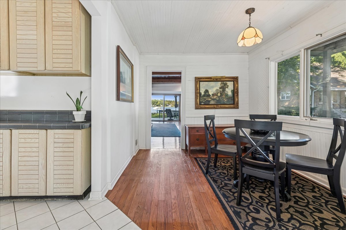712 Regner Road McHenry, IL 60051 - Photo 10 of 25 a view of a dining room with furniture and window