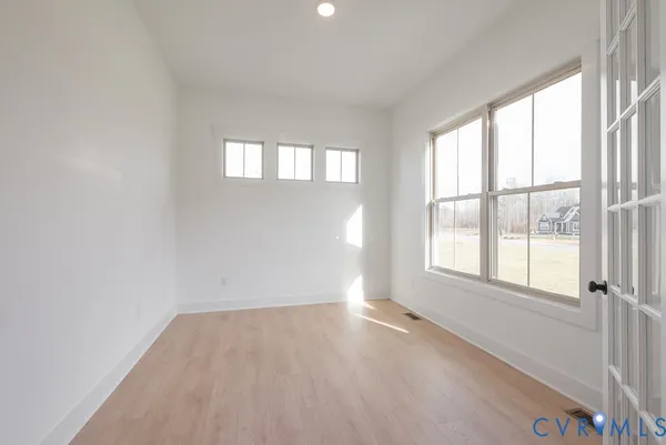 an empty room with windows