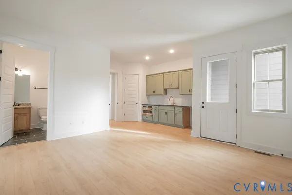 a view of a kitchen with a sink and a cabinet