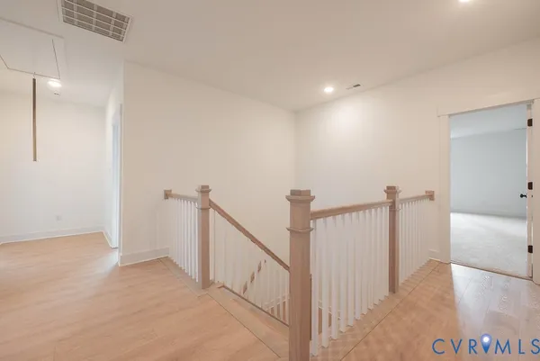 a view of a hallway with staircase