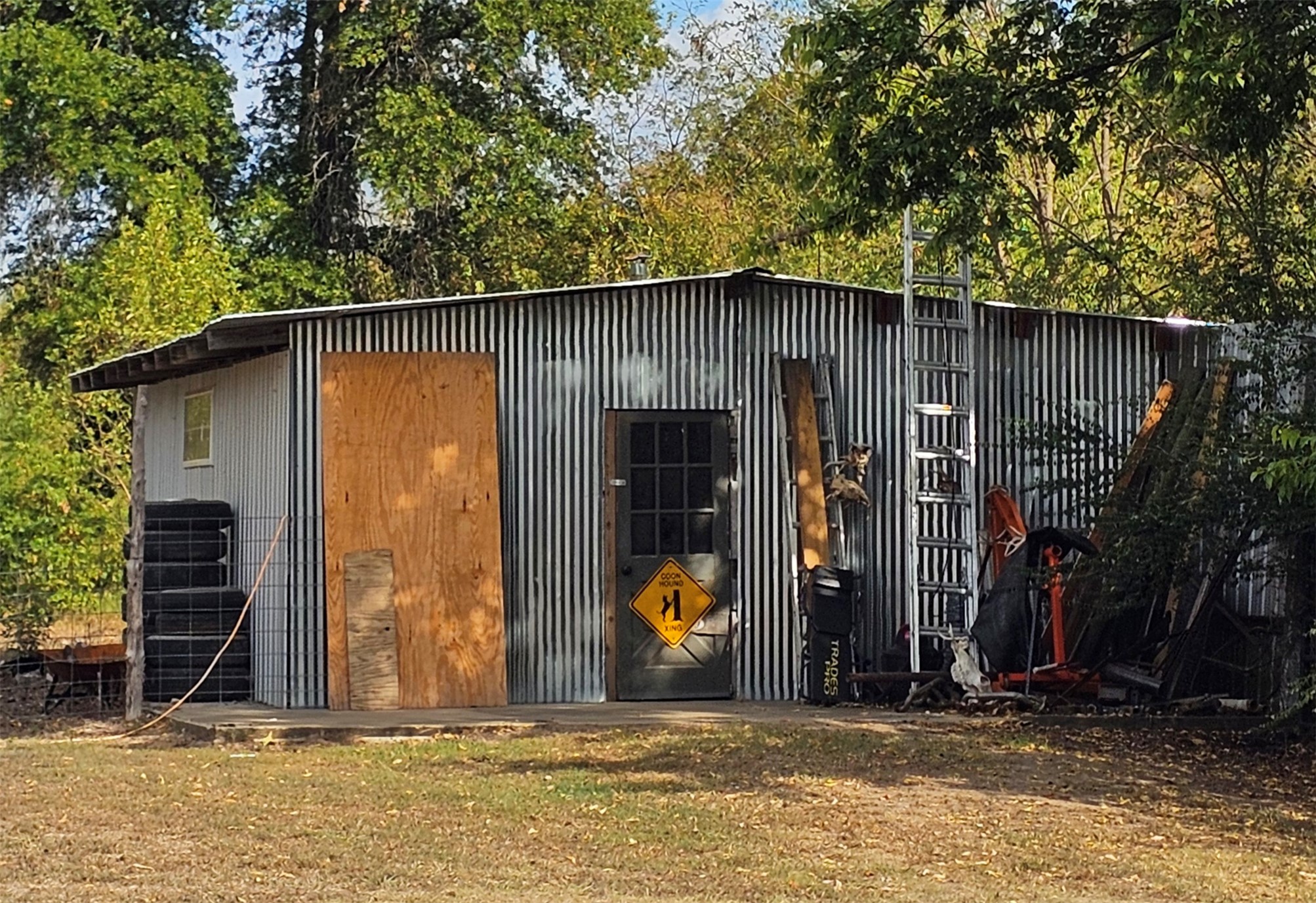 106441 South 4163rd Road Checotah, OK 74426 - Photo 12 of 17 Shop with concrete floor wood stove .