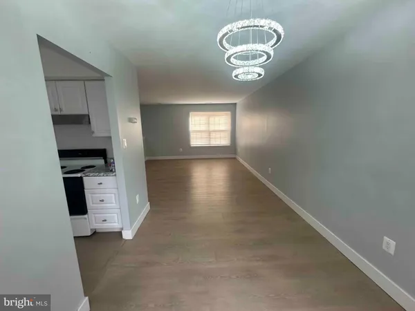 wooden floor in an empty room and a window