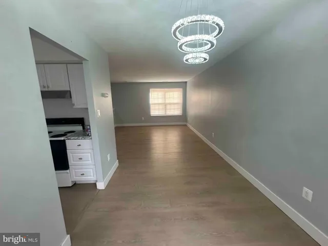 wooden floor in an empty room and a window