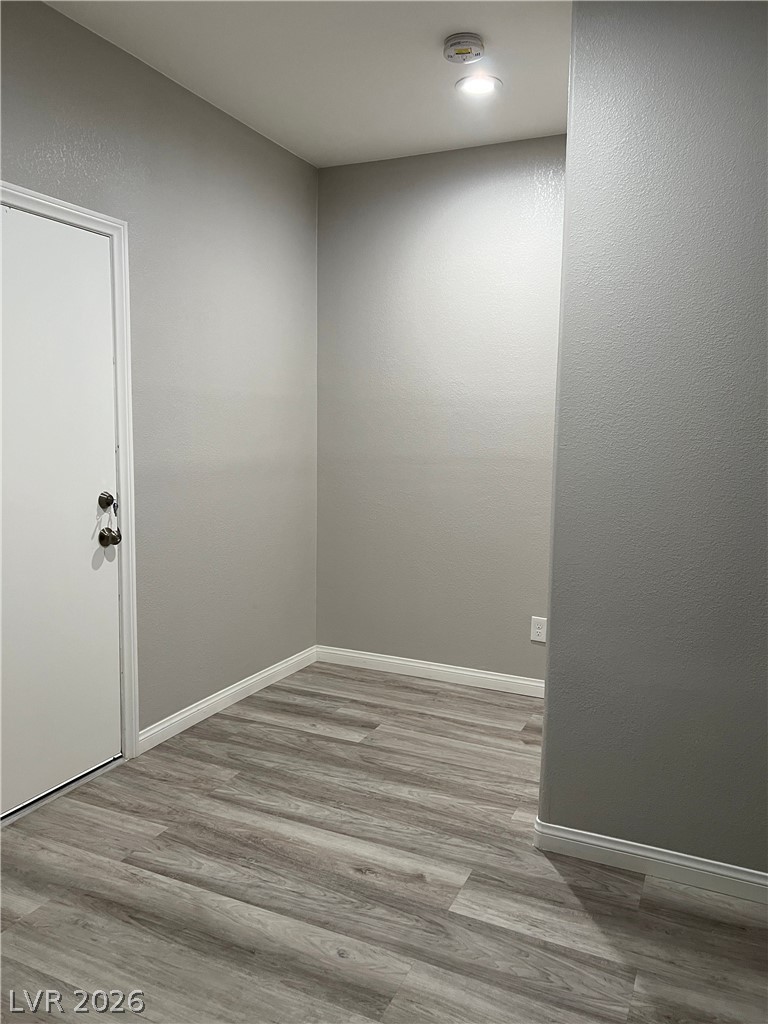 5981 Honeysuckle Ridge Street Las Vegas, NV 89148 - Photo 14 of 29 The smooth vinyl plank flooring offers a chic and resilient surface throughout the space.