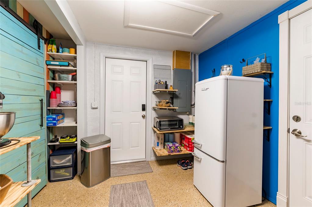 7804 Fox Hollow Drive Port Richey, FL 34668 - Photo 18 of 31 a view of a kitchen with fridge and workspace