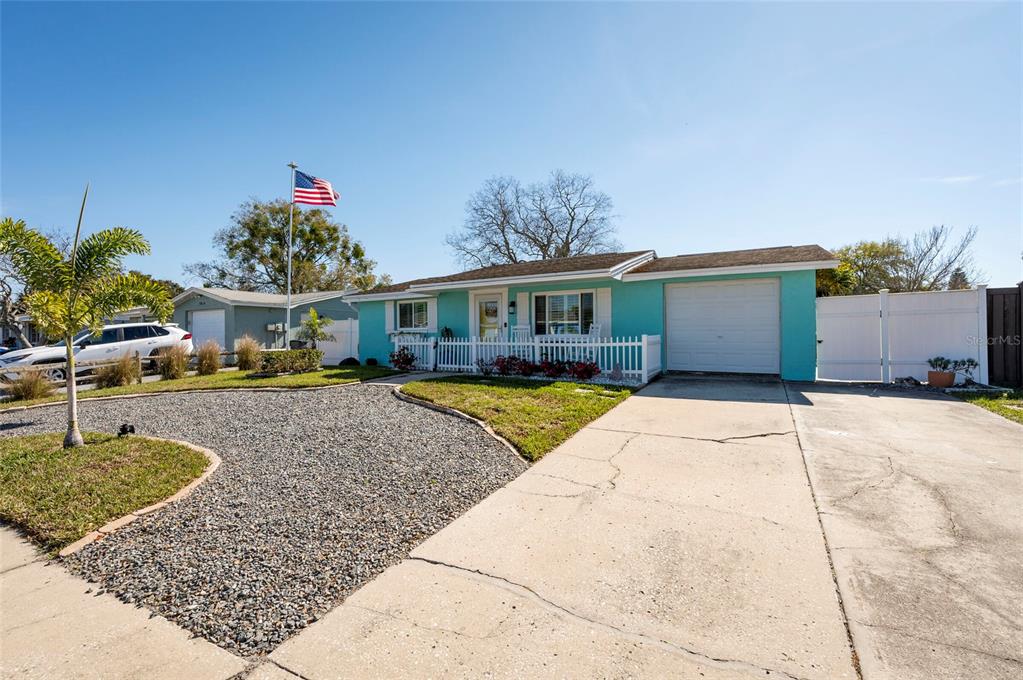 7804 Fox Hollow Drive Port Richey, FL 34668 - Photo 2 of 31 a view of a house with a swimming pool