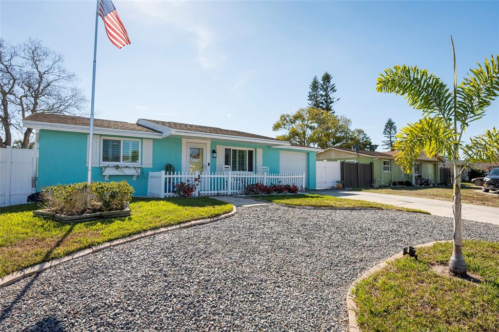 7804 Fox Hollow Drive Port Richey, FL 34668 - Photo 4 of 31 a front view of a house with a yard