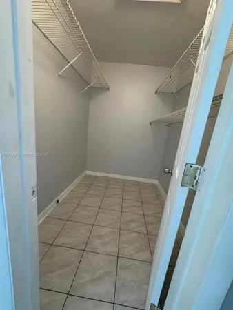 a kitchen with refrigerator and window