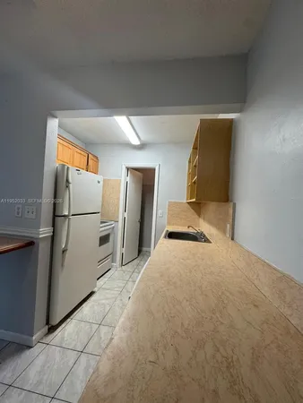 a view of a hallway with seating area