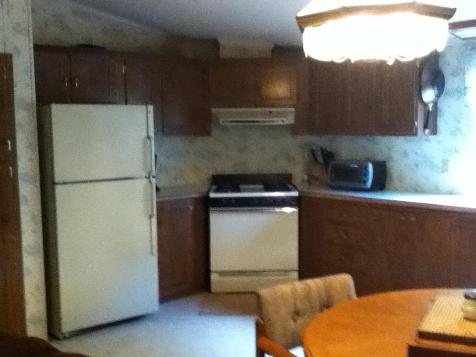 1560 Isolane Road Callaway, VA 24067 - Photo 14 of 22 a kitchen with a refrigerator and a sink