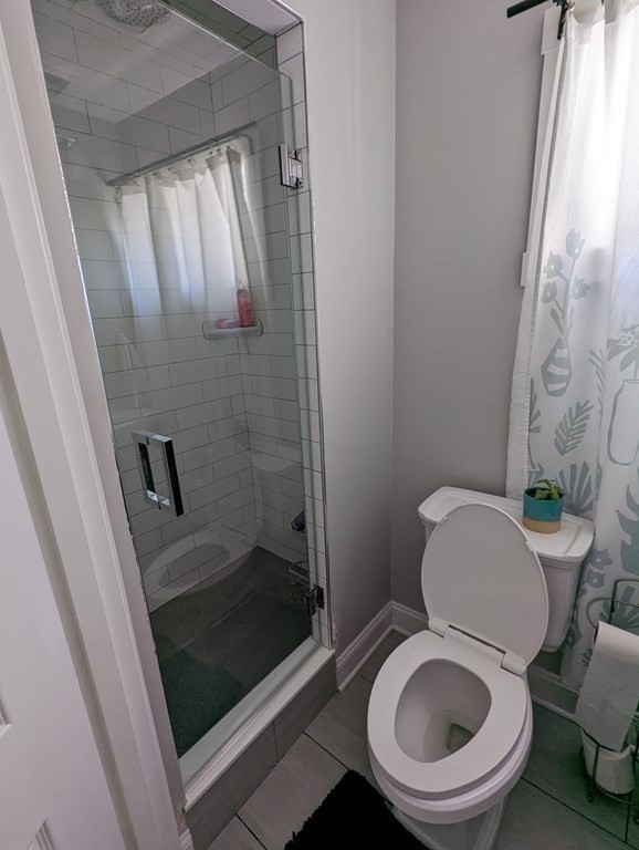 143 London Street, Unit 2 Boston, MA 02128 - Photo 4 of 9 a bathroom with a toilet and a shower