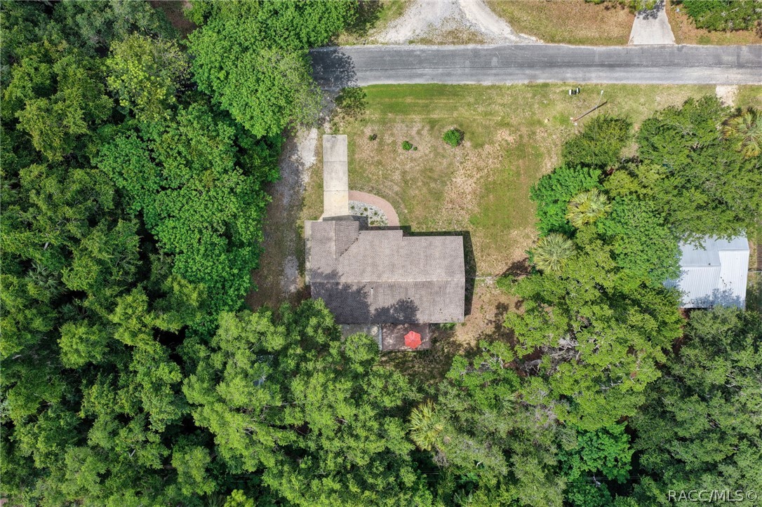 107 Allen Avenue Inglis, FL 34449 - Photo 33 of 36 an aerial view of a house with a yard