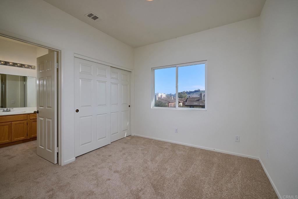 297 Diamante Way Oceanside, CA 92056 - Photo 11 of 28 a view of an empty room with a window