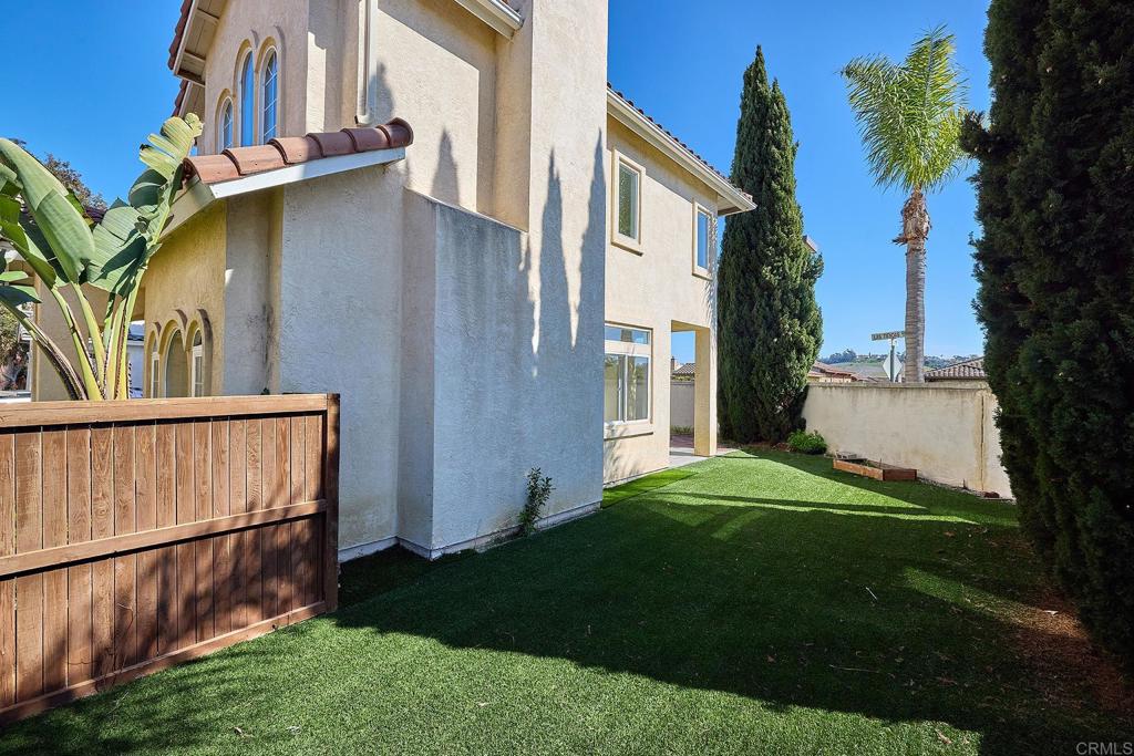 297 Diamante Way Oceanside, CA 92056 - Photo 17 of 28 a view of backyard of house and outdoor seating