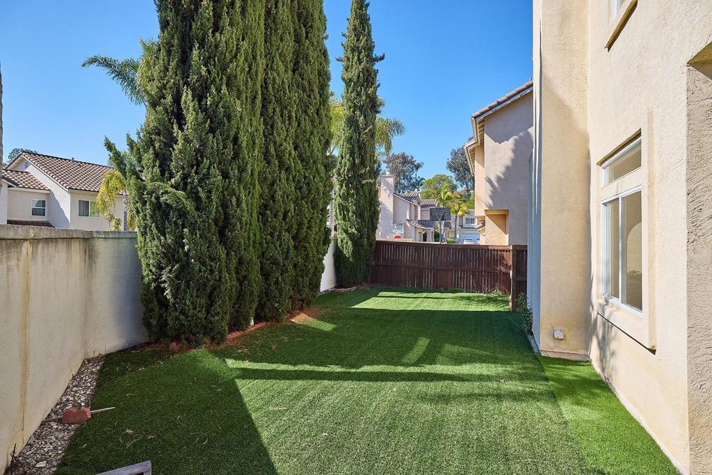 297 Diamante Way Oceanside, CA 92056 - Photo 18 of 28 a view of a backyard with garden