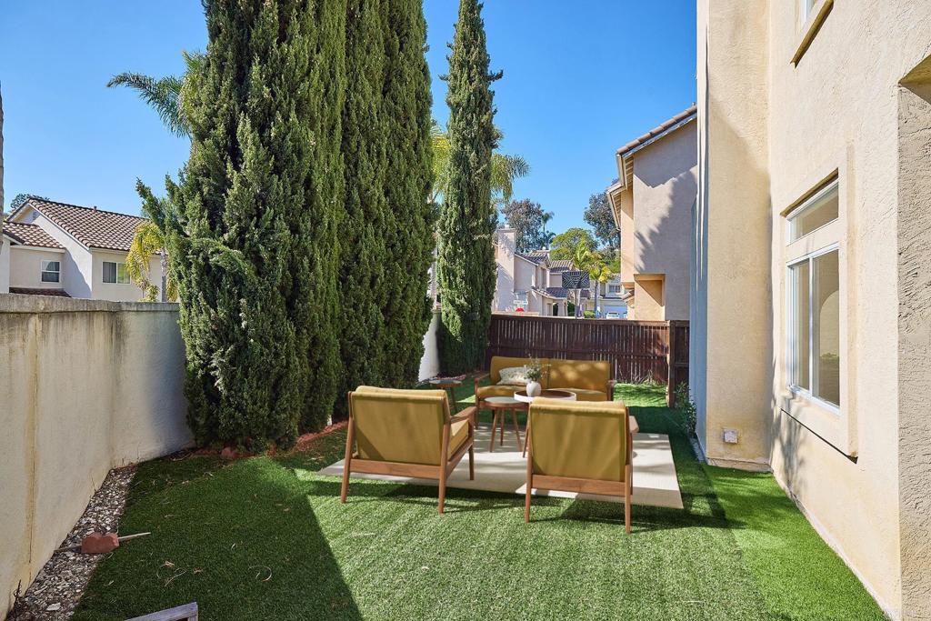 297 Diamante Way Oceanside, CA 92056 - Photo 19 of 28 a view of a chair and table in backyard of the house