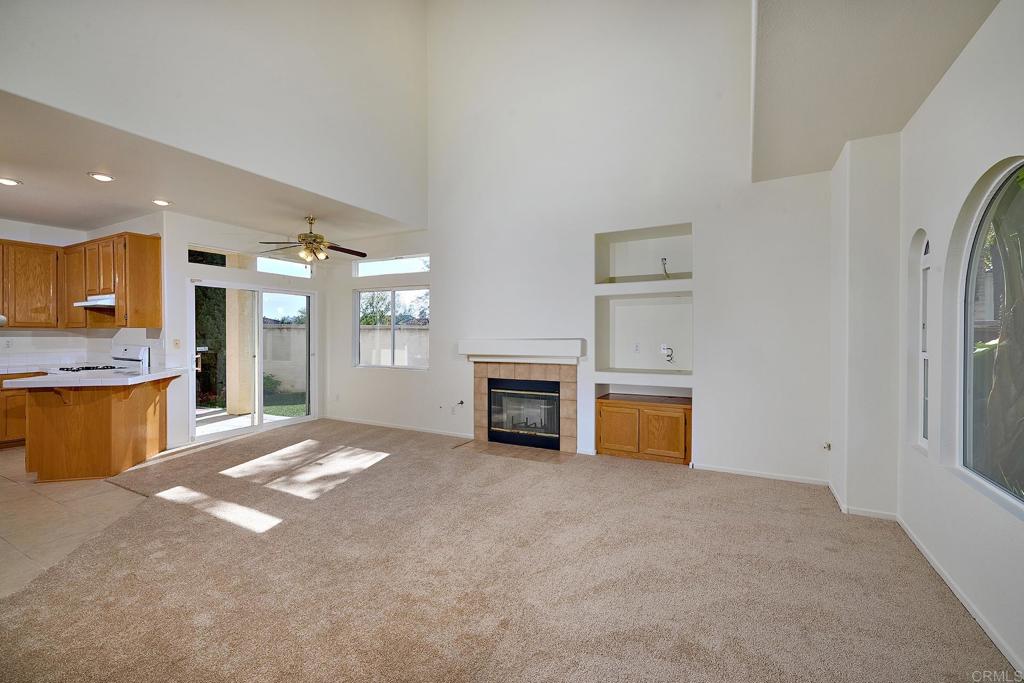 297 Diamante Way Oceanside, CA 92056 - Photo 5 of 28 a view of a kitchen with a sink and a fireplace