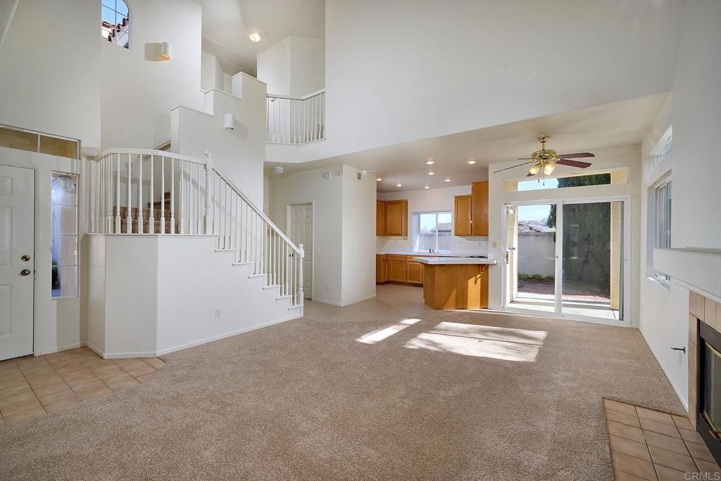 297 Diamante Way Oceanside, CA 92056 - Photo 6 of 28 a view of a big room with entryway kitchen view and living room