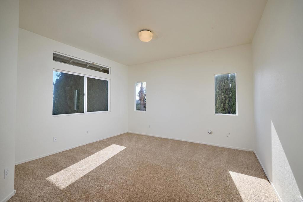 297 Diamante Way Oceanside, CA 92056 - Photo 9 of 28 a view of an empty room with window and closet area