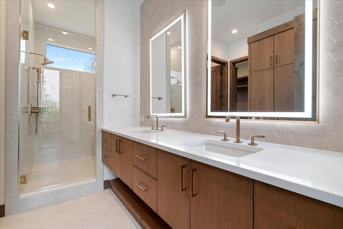 1615 Golden Eagle Road Silverthorne, CO 80498 - Photo 31 of 47 a bathroom with double sink and a mirror