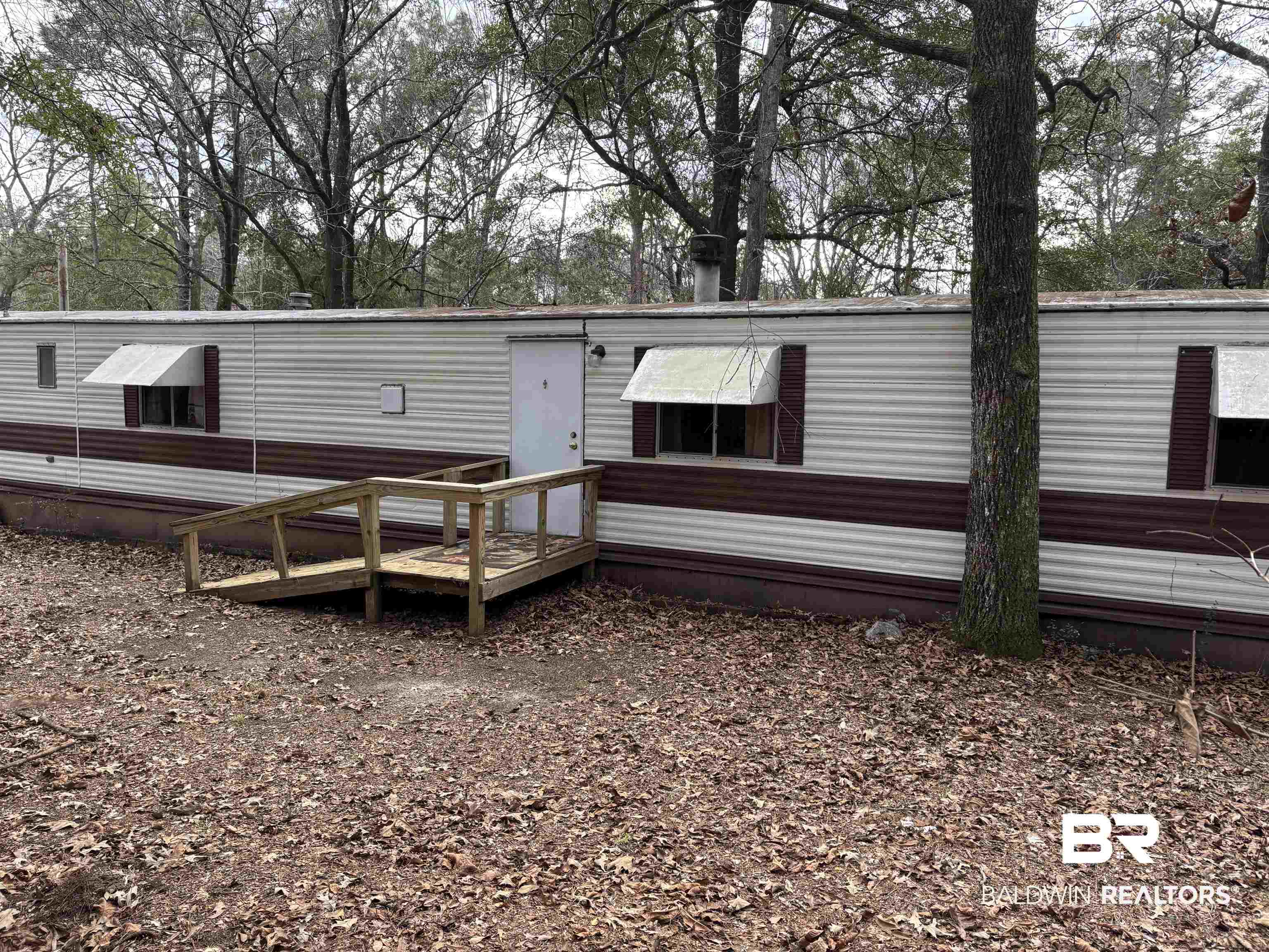 15575 Rogers Drive Chunchula, AL 36521 - Photo 9 of 42 Back of house with a wooden deck