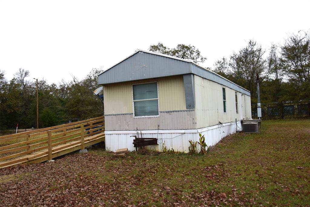 6000 Spring Creek Road, Unit 12 Malakoff, TX 75148 - Photo 1 of 10 a view of a house with a yard