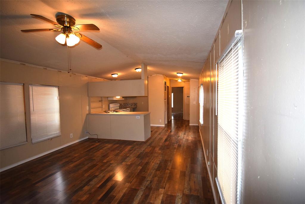 6000 Spring Creek Road, Unit 12 Malakoff, TX 75148 - Photo 2 of 10 a view of a hallway with wooden floor
