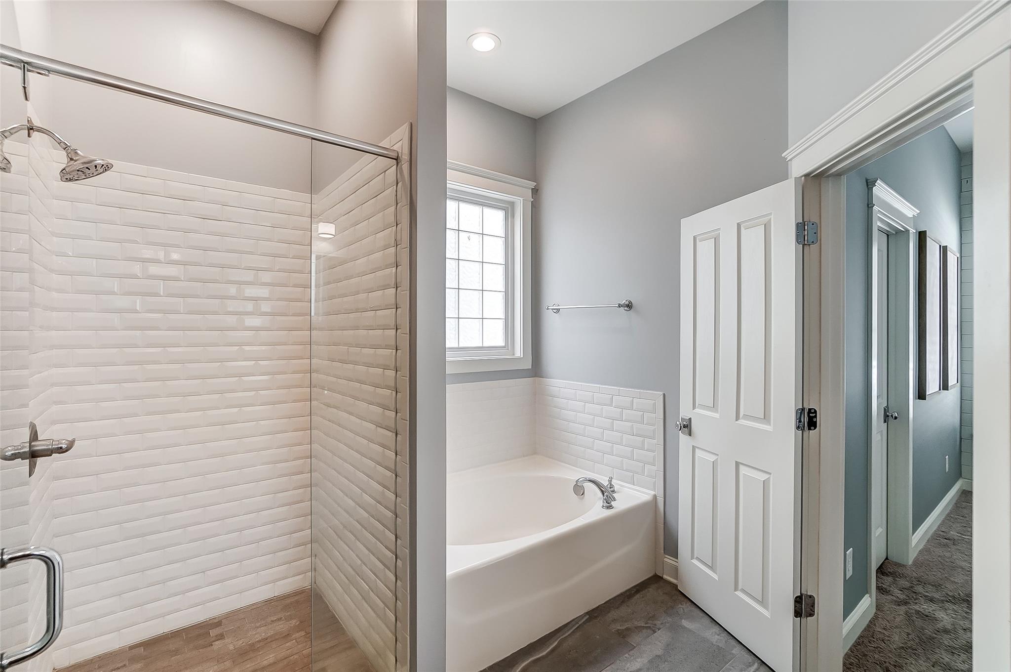 3400 Richard's Crossing Fort Mill, SC 29708 - Photo 23 of 48 a bathroom with a bathtub a shower and a window