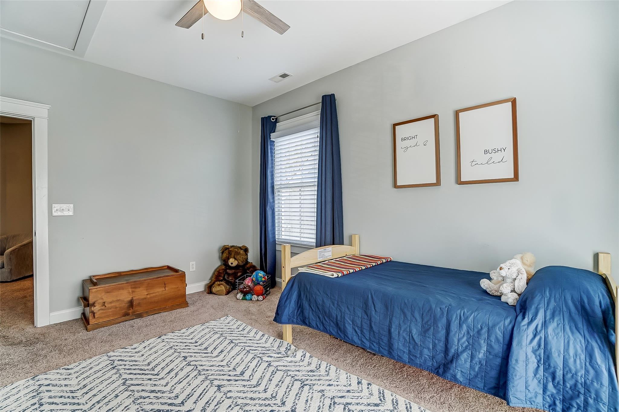 3400 Richard's Crossing Fort Mill, SC 29708 - Photo 28 of 48 a bedroom with a bed and a chandelier