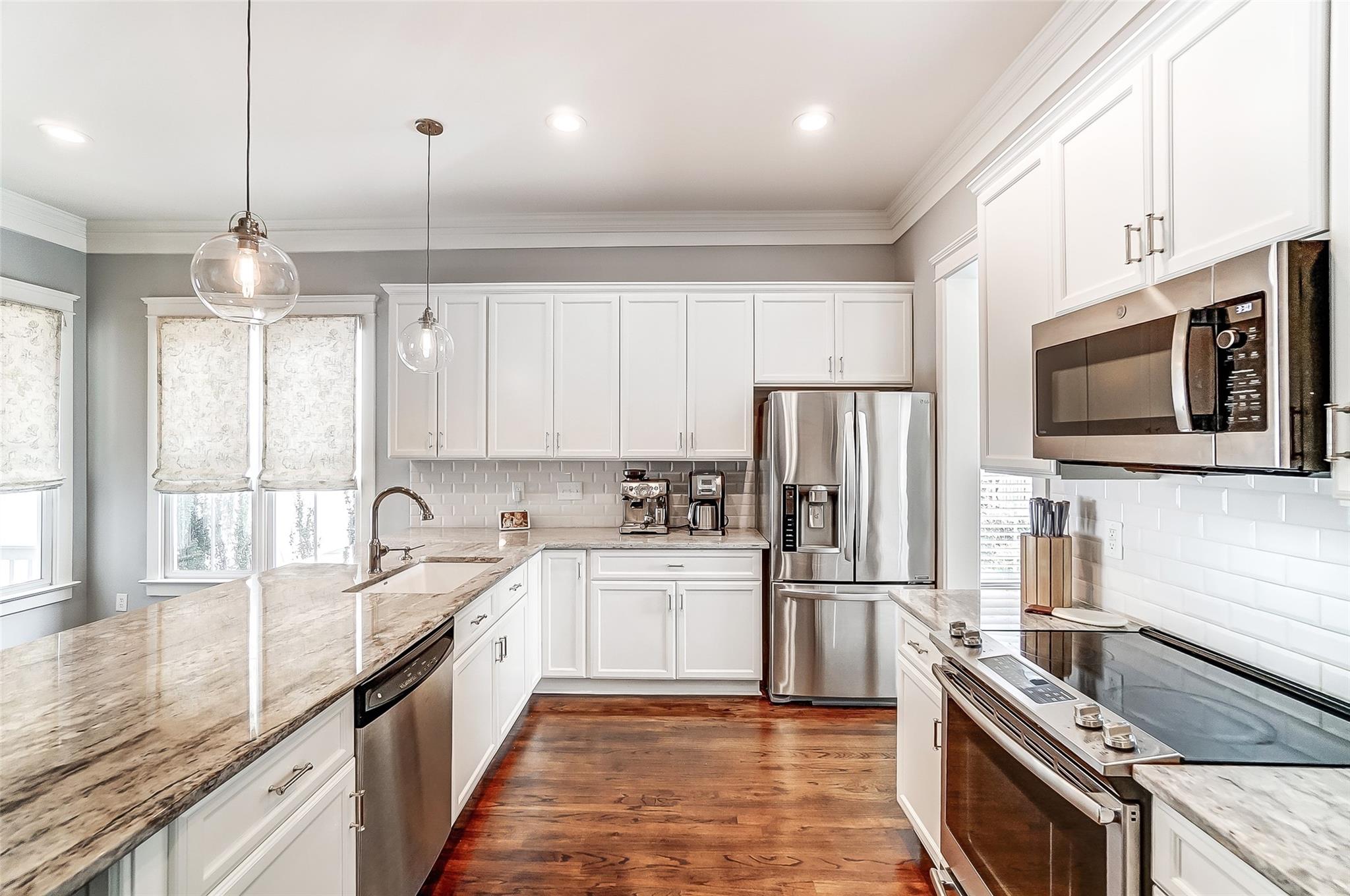 3400 Richard's Crossing Fort Mill, SC 29708 - Photo 9 of 48 a kitchen with stainless steel appliances granite countertop a sink a stove a refrigerator cabinets and a kitchen island