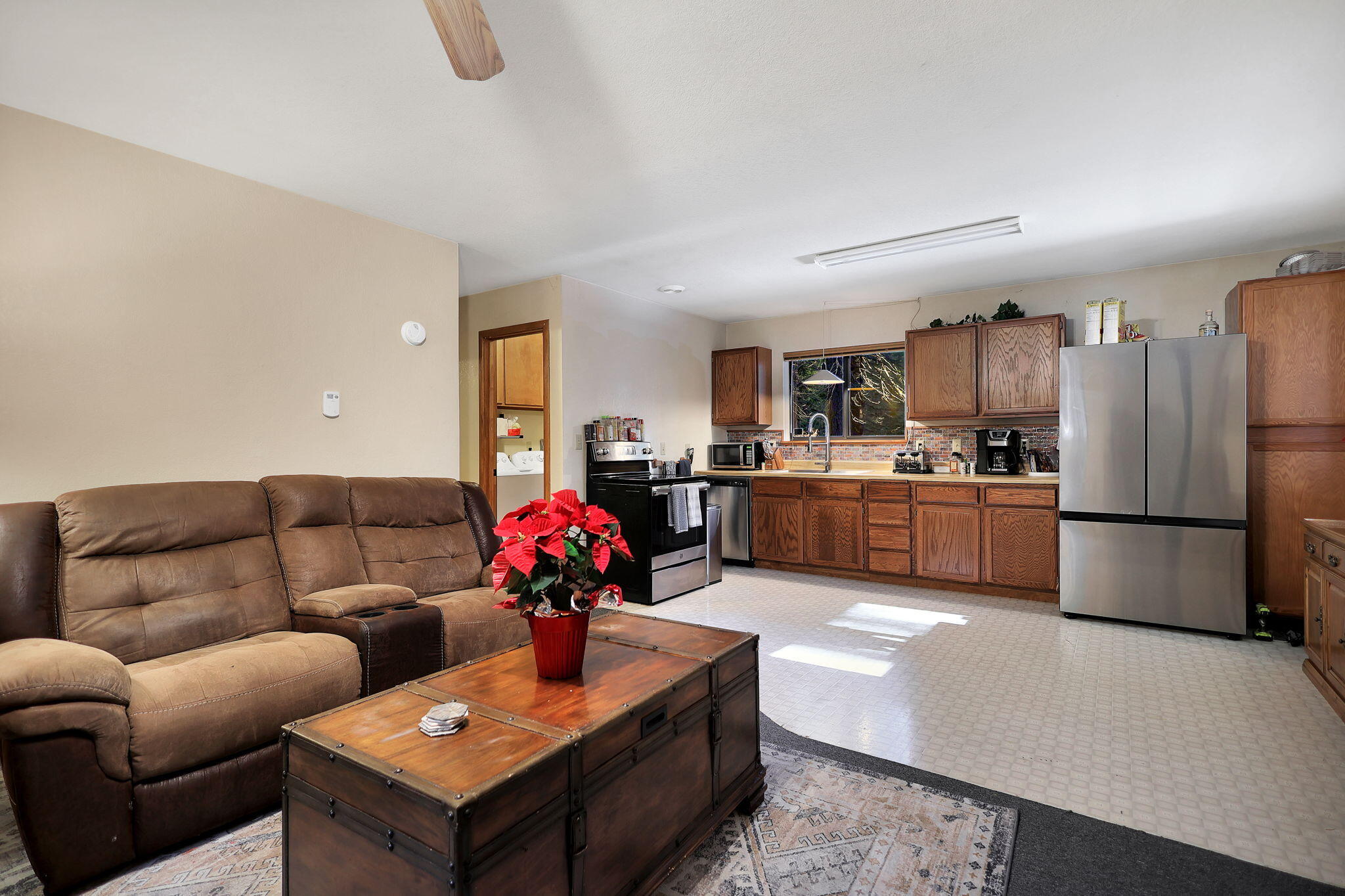 9442 Thatcher Mill Road Shingletown, CA 96088 - Photo 5 of 19 a living room with furniture and kitchen view