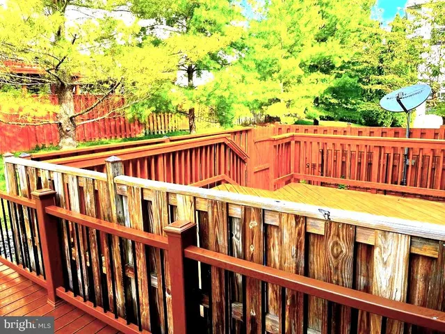 a view of a balcony with wooden floor