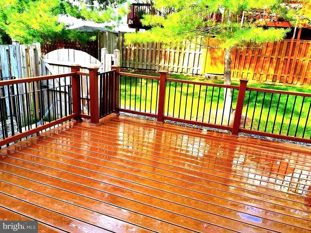 a view of balcony with wooden fence