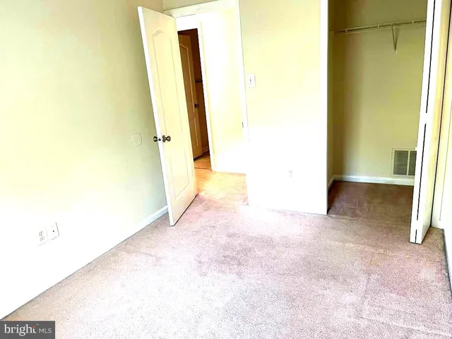 an empty room with a mirror