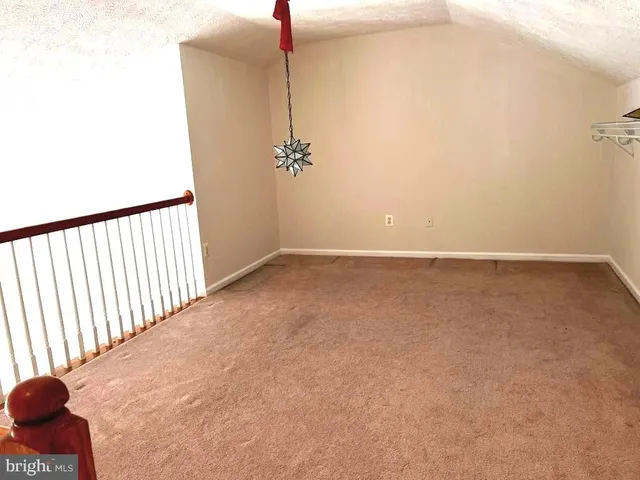 a white toilet sitting next to a bath tub and a shower