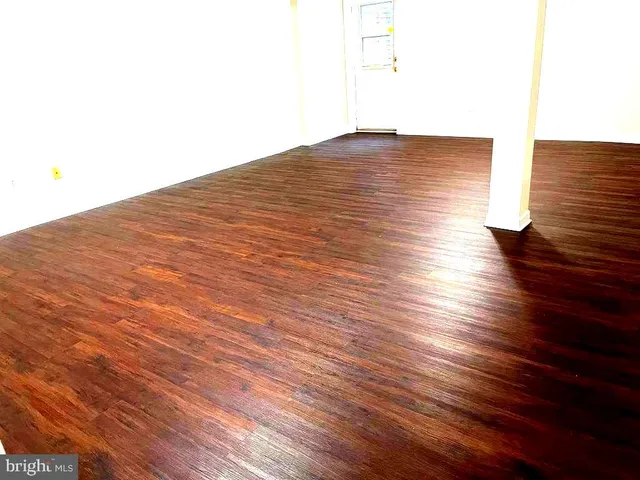 a white toilet sitting next to a shower