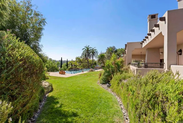 a wooden bench with view of trees