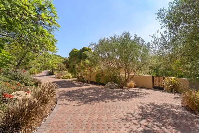 a large building with a large tree in front