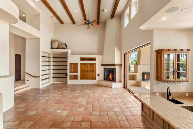 a large kitchen with stainless steel appliances granite countertop a large center island and a sink