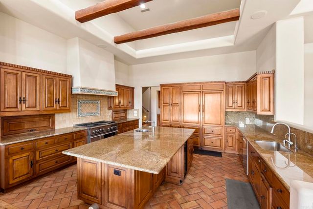 a view of a dining room with furniture large windows and wooden floor