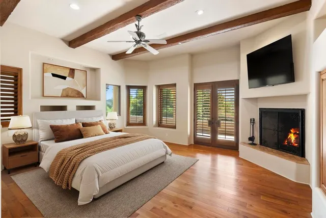 a living room with furniture and large windows