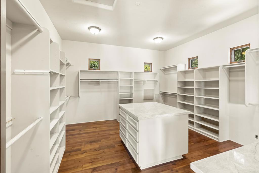 3435 Jasmine Crest Encinitas, CA 92024 - Photo 32 of 41 a view of a walk in closet and wooden floor