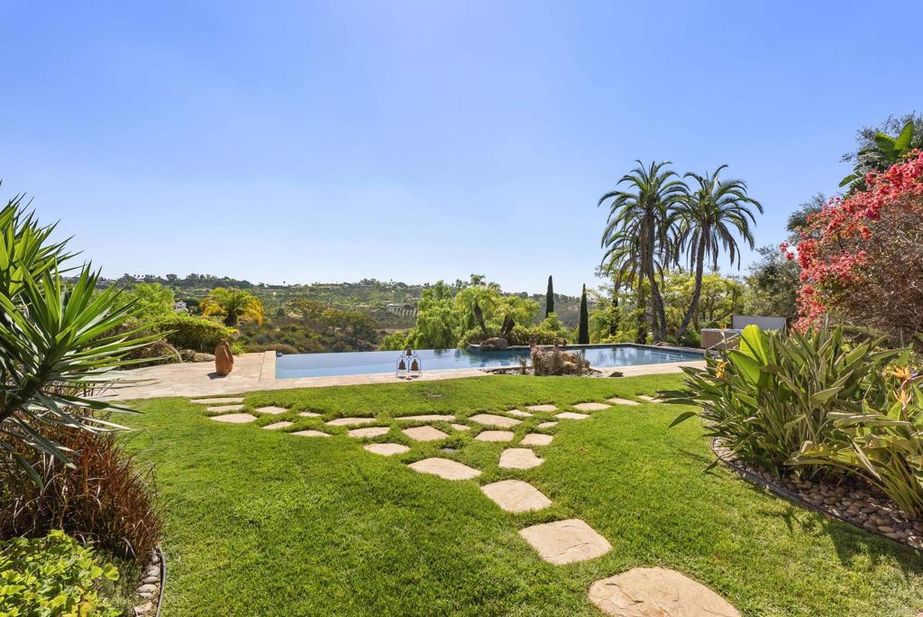 3435 Jasmine Crest Encinitas, CA 92024 - Photo 37 of 41 a swimming pool with plants and large trees