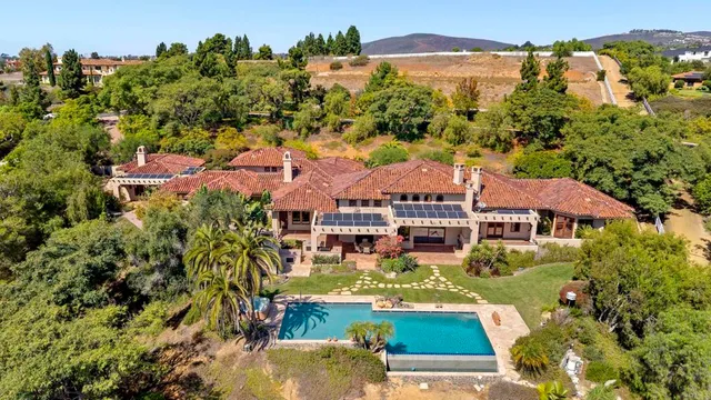an aerial view of house with yard swimming pool and outdoor seating