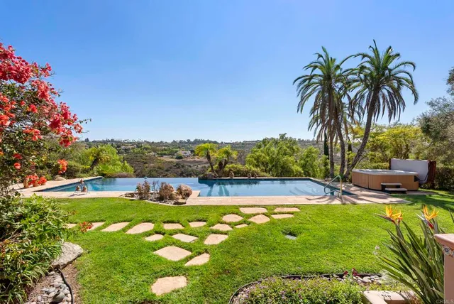 a view of a swimming pool with a patio