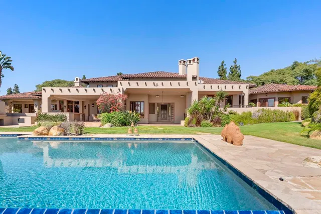 a view of a lake with a city skyline in the background