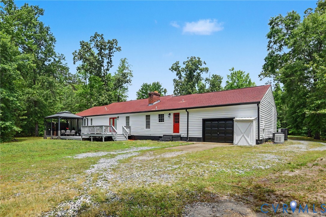 9820 Beaver Bridge Road Chesterfield, VA 23838 - Photo 47 of 54 White siding exterior with a red roof, featuring a